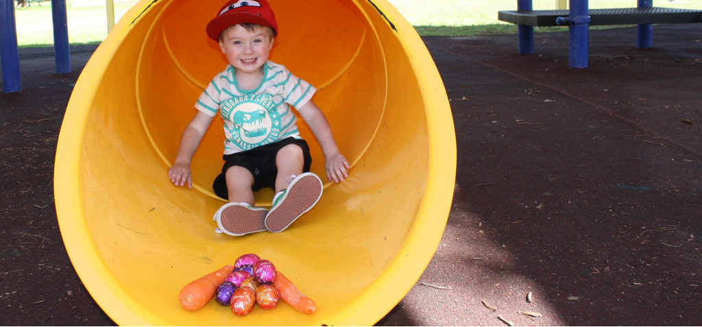 Harley Heinemann, 4, is more tempted by a carrot than an Easter egg.